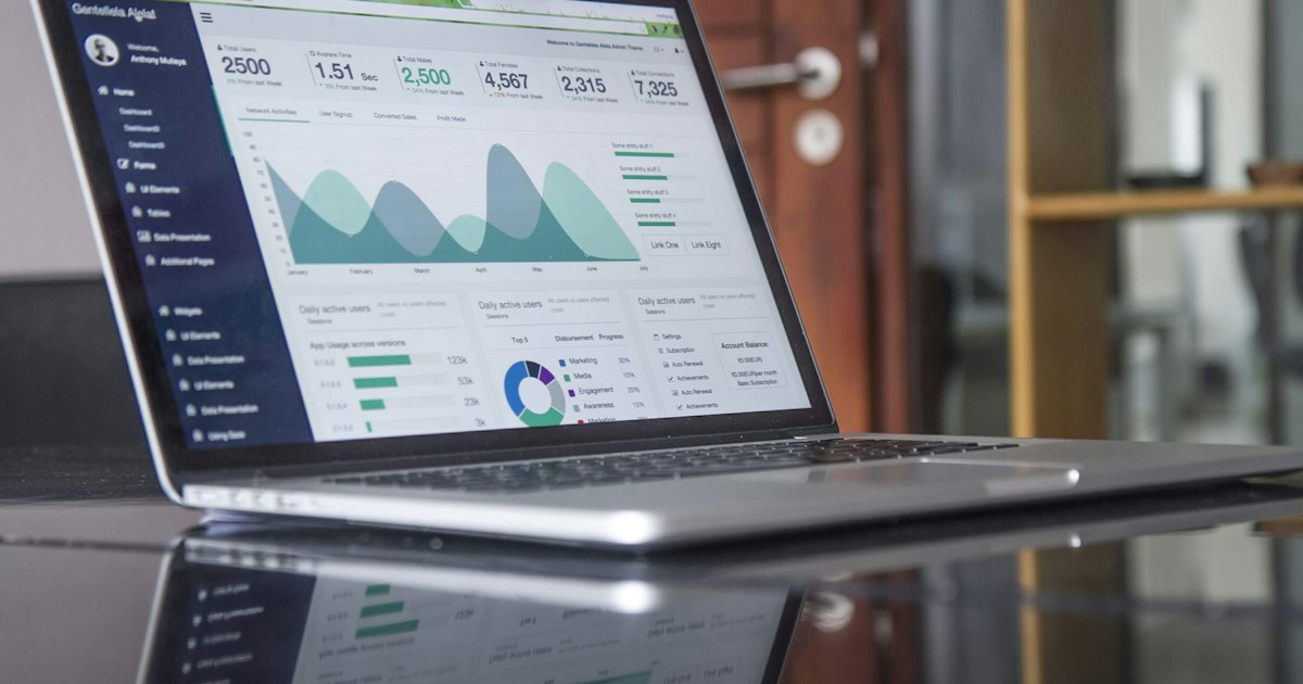 Laptop screen showing analytics graphs and performance metrics